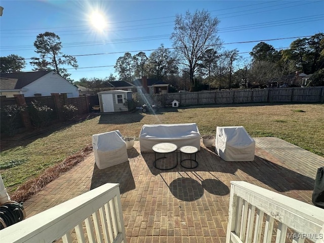 view of patio featuring area for grilling and a shed