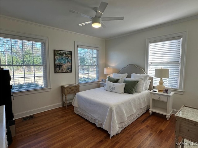 bedroom with multiple windows, ceiling fan, crown molding, and dark hardwood / wood-style floors