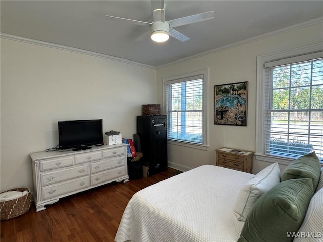 bedroom with dark hardwood / wood-style flooring, ceiling fan, and ornamental molding