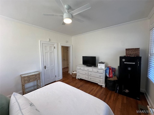 bedroom featuring ceiling fan, dark hardwood / wood-style flooring, and crown molding