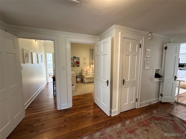 corridor featuring dark hardwood / wood-style flooring and ornamental molding