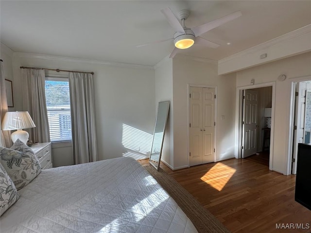 bedroom with ceiling fan, ornamental molding, and hardwood / wood-style flooring