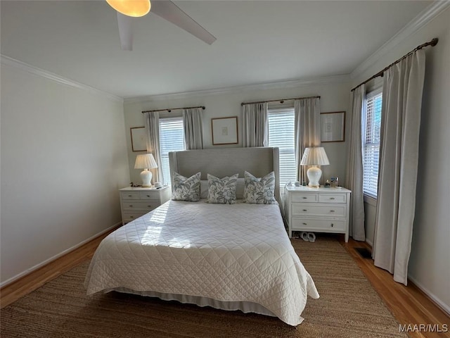 bedroom featuring wood-type flooring, ceiling fan, and crown molding