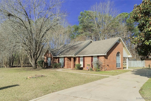 ranch-style home featuring a front yard