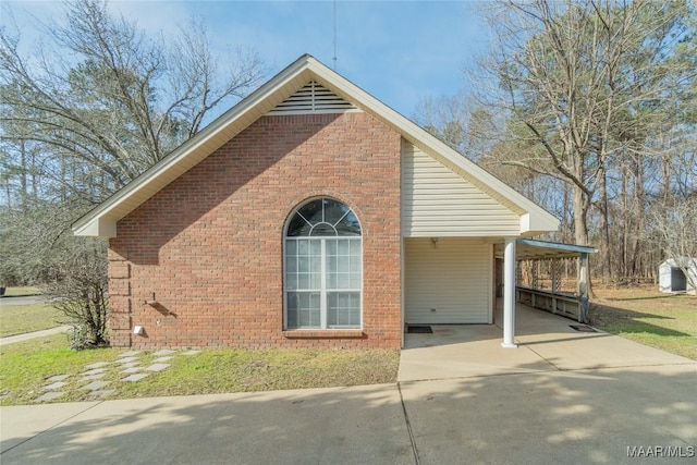 view of side of property with a carport