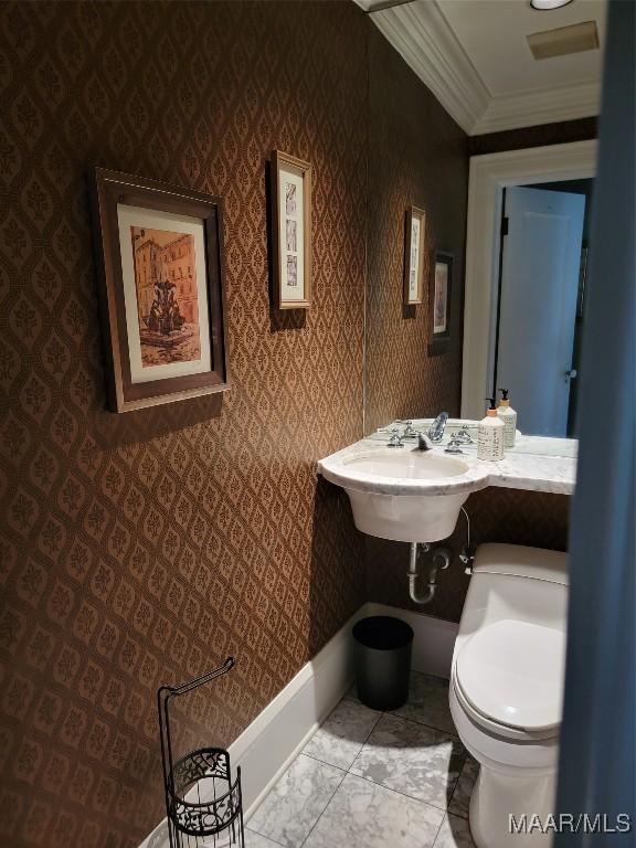 835 Park Ave, Montgomery, AL 36106 - bathroom with toilet, ornamental molding, and sink
