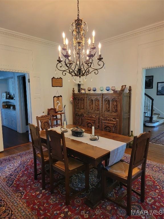835 Park Ave, Montgomery, AL 36106 - dining room with hardwood / wood-style flooring, ornamental molding, and a notable chandelier