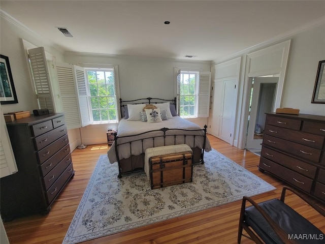 835 Park Ave, Montgomery, AL 36106 - bedroom with light wood-type flooring and crown molding
