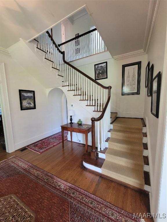 835 Park Ave, Montgomery, AL 36106 - staircase with wood-type flooring and crown molding