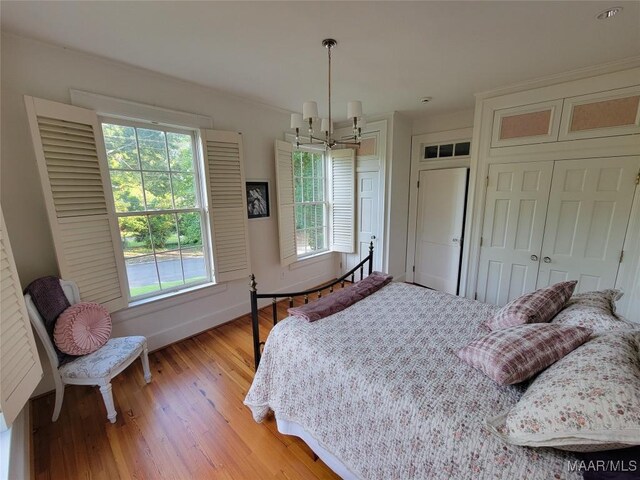 835 Park Ave, Montgomery, AL 36106 - bedroom featuring a notable chandelier and light hardwood / wood-style flooring