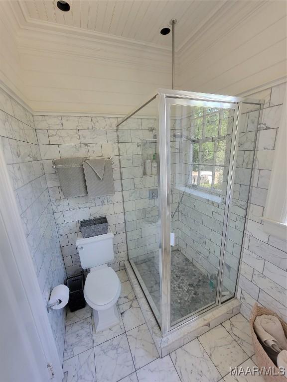 835 Park Ave, Montgomery, AL 36106 - bathroom with a shower with door, tile walls, and toilet