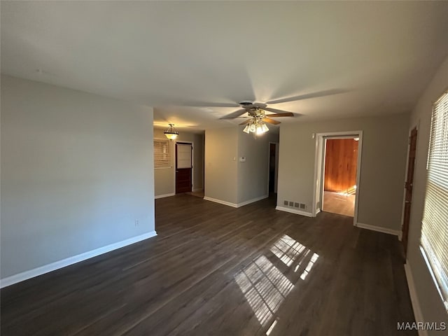 interior space with dark hardwood / wood-style floors and ceiling fan