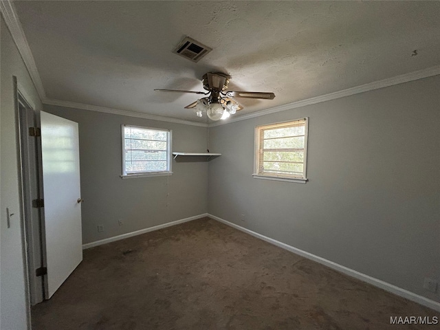 spare room with ceiling fan and ornamental molding