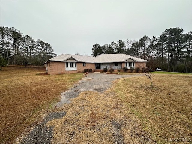 ranch-style house with a front lawn