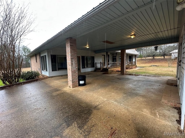 exterior space featuring a porch and a carport