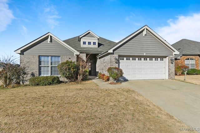 view of front of house featuring a front lawn and a garage