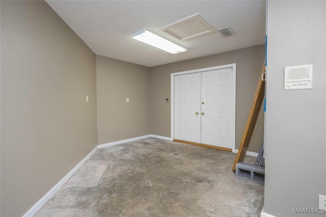 interior space featuring a textured ceiling