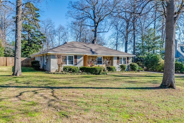 ranch-style home with a front lawn