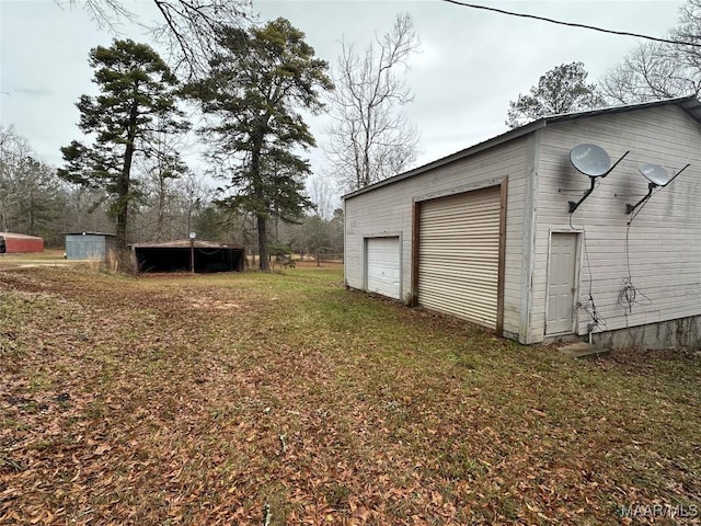 garage with a lawn