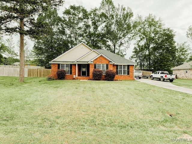 single story home featuring a front lawn