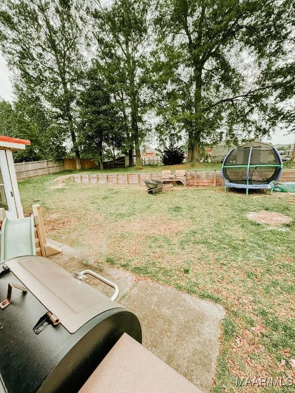 view of yard featuring a trampoline