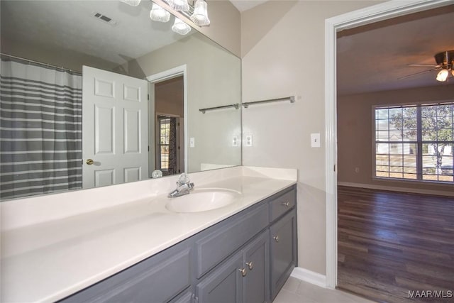 bathroom featuring vanity and ceiling fan