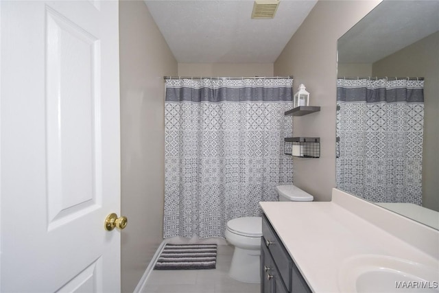 bathroom with a textured ceiling, a shower with shower curtain, tile patterned flooring, toilet, and vanity