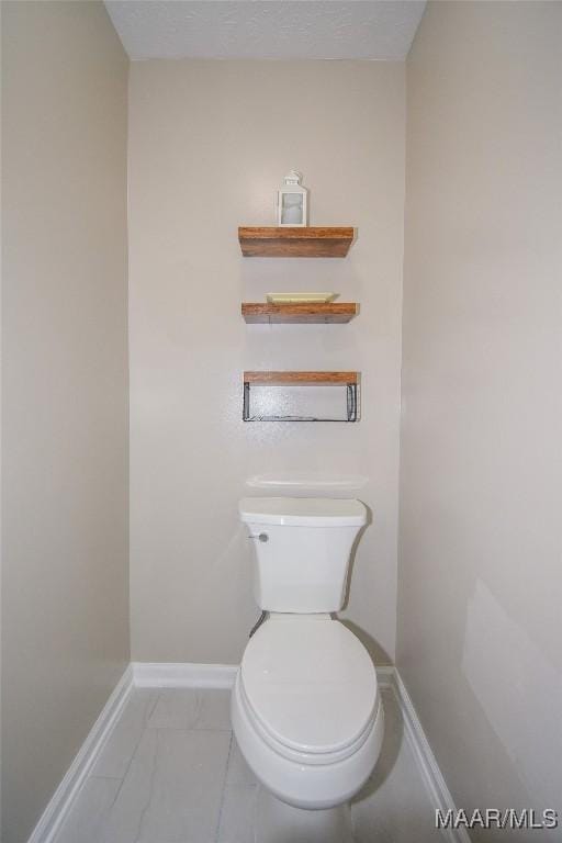 bathroom featuring toilet