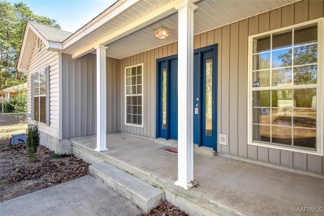 doorway to property featuring covered porch