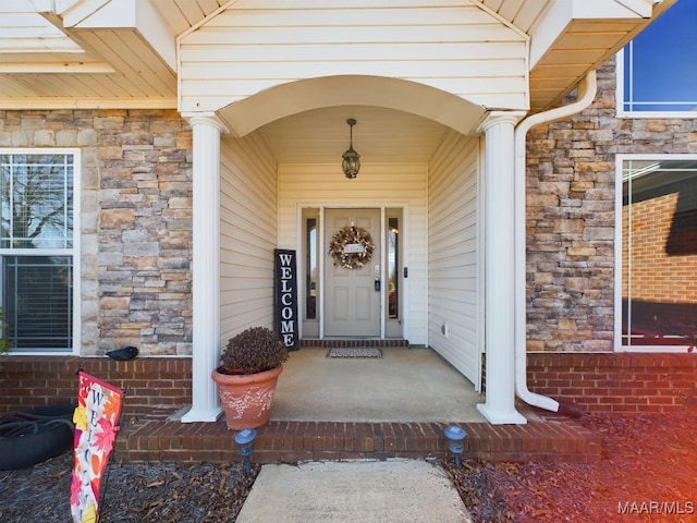 doorway to property with a porch