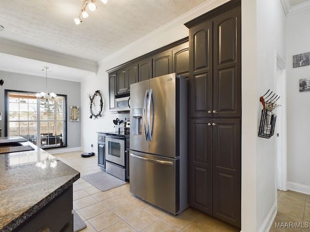 kitchen featuring appliances with stainless steel finishes, a textured ceiling, light tile patterned floors, and dark brown cabinets