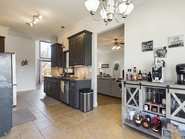 kitchen featuring ceiling fan with notable chandelier, stainless steel dishwasher, light tile patterned floors, a textured ceiling, and white fridge