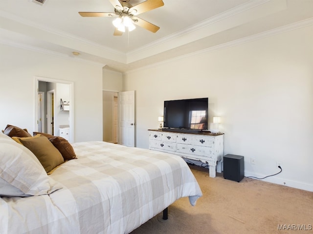 carpeted bedroom with a tray ceiling, ceiling fan, and crown molding