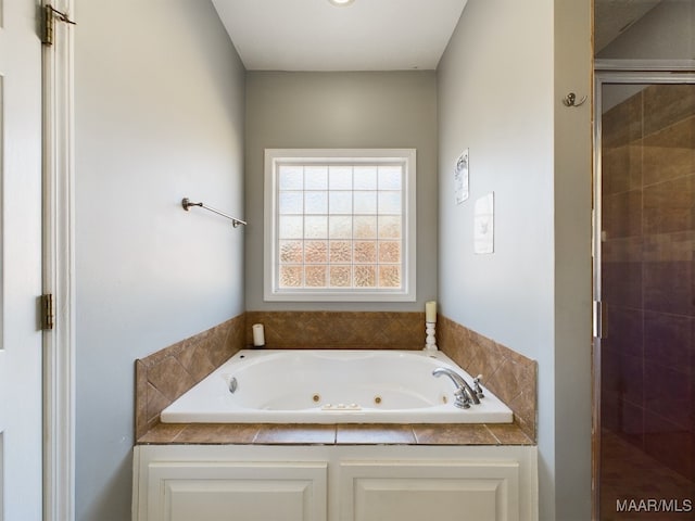 bathroom with shower with separate bathtub