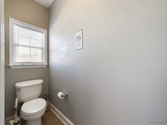 bathroom featuring tile patterned flooring and toilet