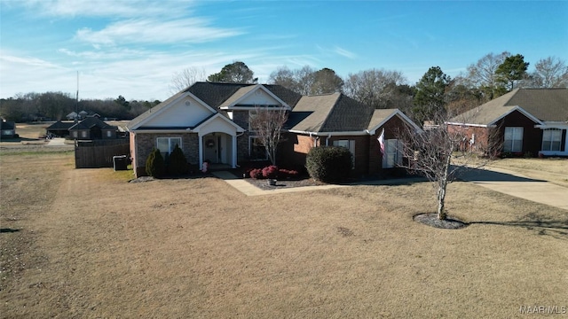 ranch-style home with a front lawn