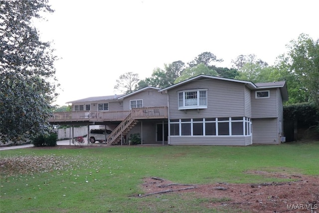 back of property featuring a yard, a deck, and stairway