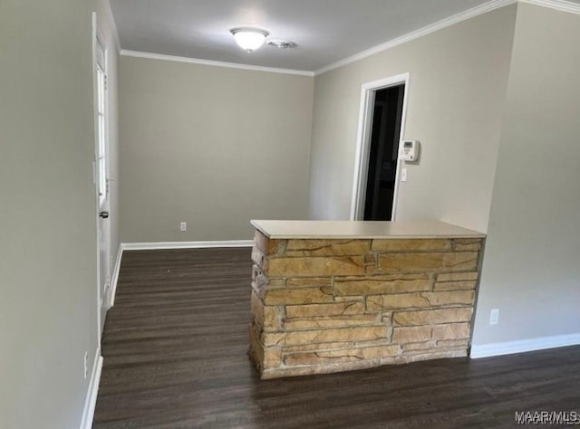 bar featuring dark wood-type flooring and ornamental molding