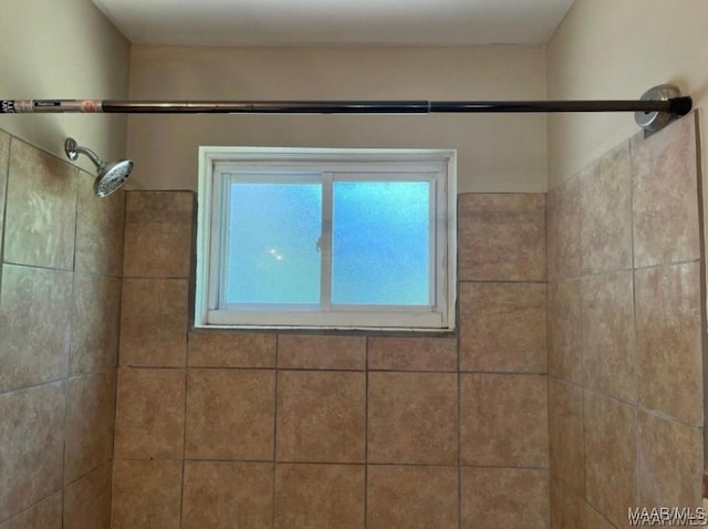 room details with a tile shower