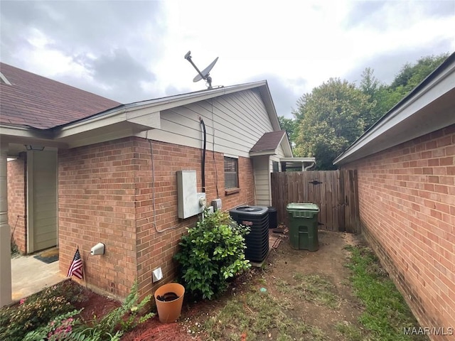 view of side of property with central AC