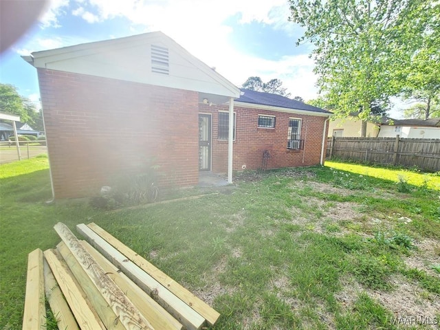 rear view of house with a lawn