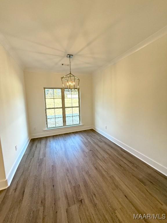 interior space featuring dark wood-style floors, a chandelier, and baseboards