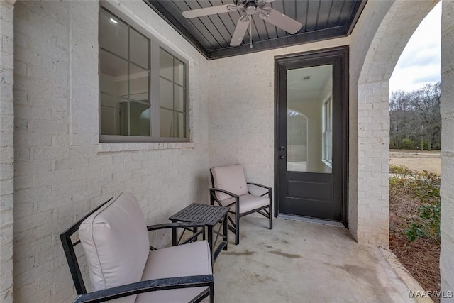 doorway to property featuring a patio area and ceiling fan