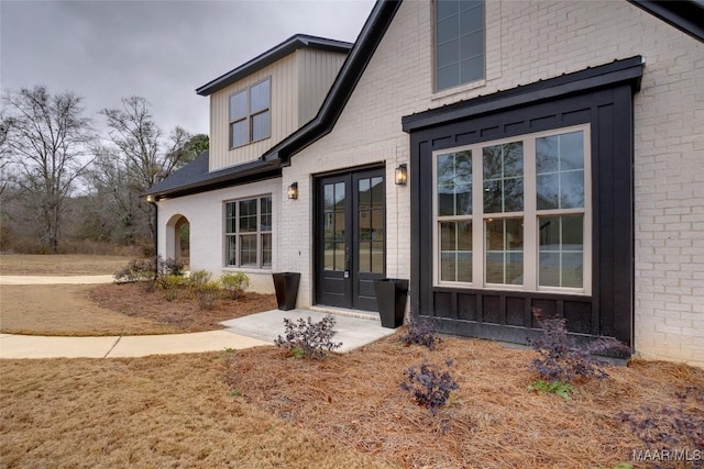 rear view of house featuring french doors