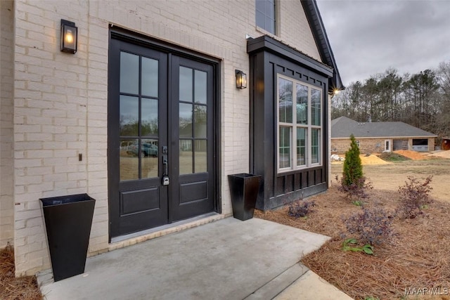 property entrance featuring french doors