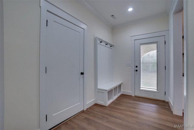 mudroom featuring light hardwood / wood-style floors and ornamental molding