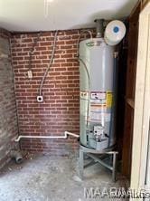 utility room with gas water heater