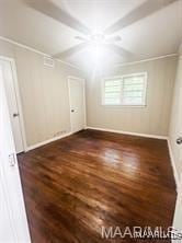 additional living space with dark hardwood / wood-style flooring