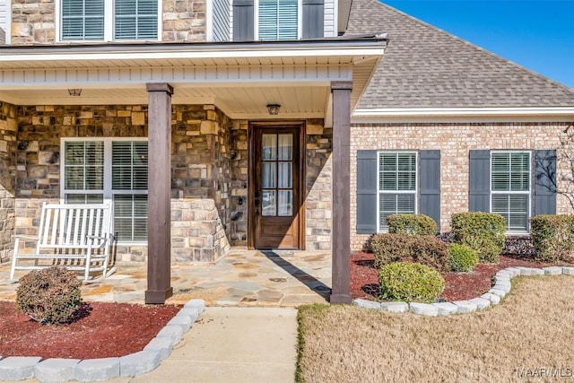 property entrance featuring covered porch