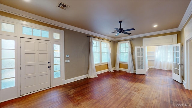 entryway with crown molding, dark wood-type flooring, ceiling fan, and french doors